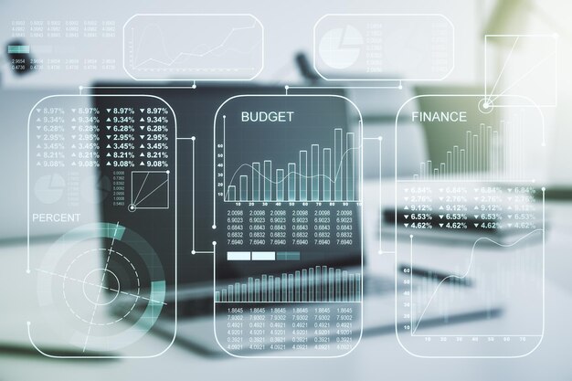 Multi exposure of stats data illustration on modern laptop background computing and analytics concept
