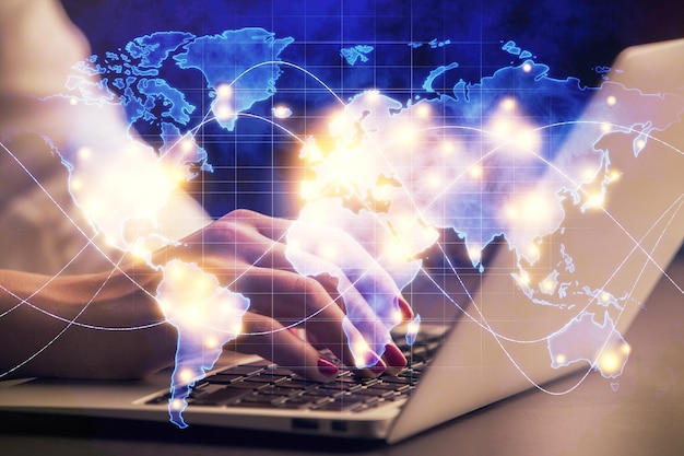 Multi exposure of woman hands typing on computer and business theme hologram drawing Success concept