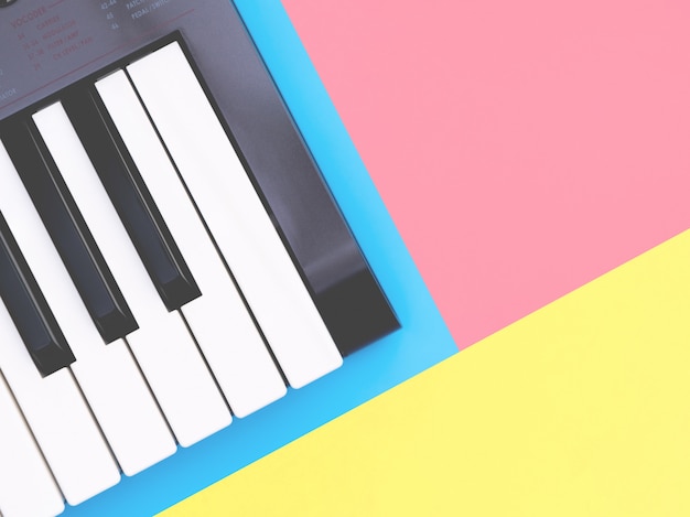 Music keyboard synthesizer instrument on blue copy space for Music poster concept