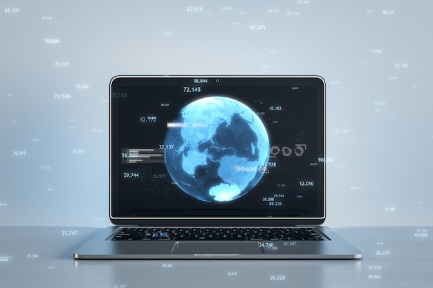 Närbild av bärbar dator med kreativt glödande blått kart- eller globehologram på suddig arbetsplatsbakgrund. Jordens metaverse och teknikkoncept 3D-rendering