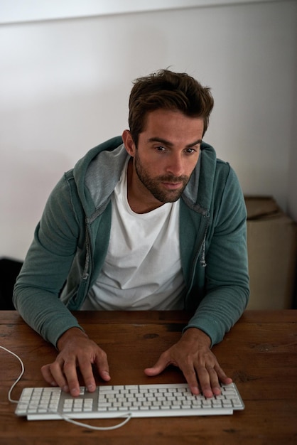 Night designer and man on computer for digital software research and web design programming Startup problem solving and programmer coding late in office and overtime for cybersecurity network
