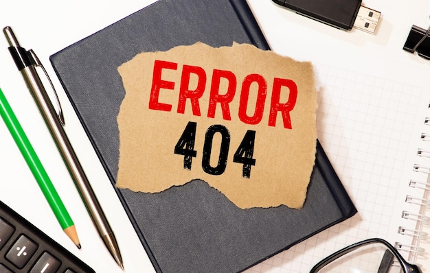 Notebook with an 404 error and sticker today on wooden desk with cup of coffee and muffin