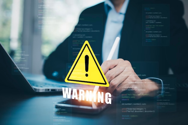 notification error 404 and maintenance with triangle caution warning sign for notification error Programmer using laptop with triangle caution warning sign hacker attacks cyber crime cyber security