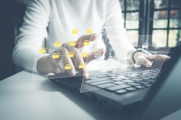 Officer using laptop manage files Document Management System DMS Online document