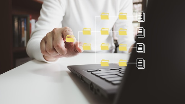 Officer using laptop manage files Document Management System DMS