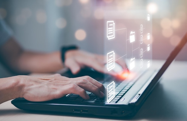 Online documentation database and document management system concept, Businessman using tablet or computer,Document Management System and Automation software to archiving and efficiently manage.