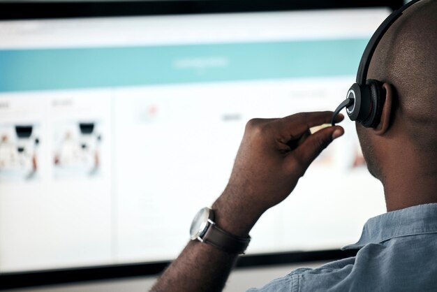 online sales employee crm consultant and telemarketing call center worker helping customer with faq or contact us call digital customer service black man with headset and internet consulting agent
