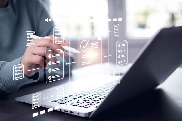 Online survey filling out and digital form checklist by laptop computer Document Management Checking System online documentation database and process manage files