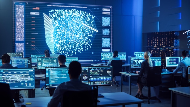 People in a room with a large screen that says'cyber security '