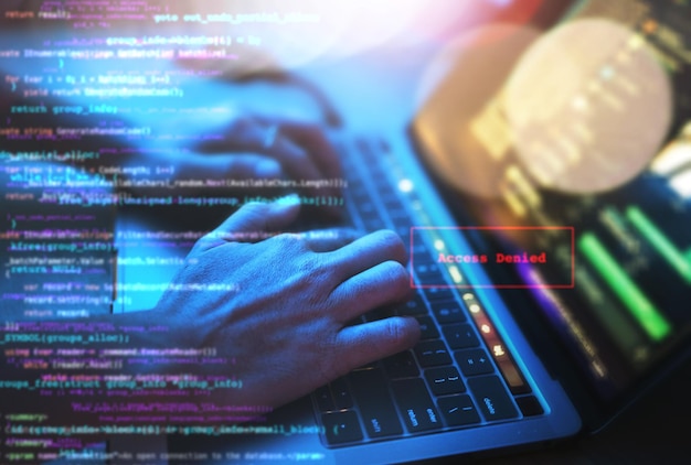 person hands laptop or coding in night office on typing iot website code or double exposure overlay information technology double exposure or cybersecurity data hacker online on keyboard in dark