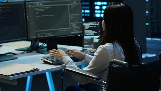 Person with paraplegia in inclusive server hub overseeing data center