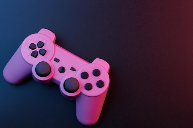 Pink video game controller joystick for game console isolated on black background Gamer control device closeup