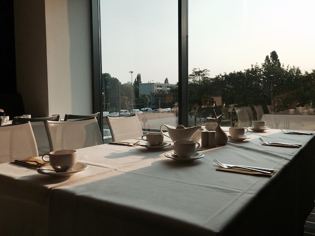 Place setting in restaurant against clear sky
