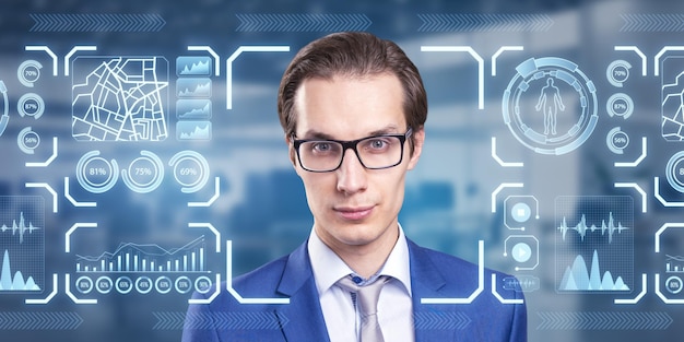 Portrait of attractive pensive businessman with glowing face recognition hologram on blurry office interior background Scanning and personal safety concept