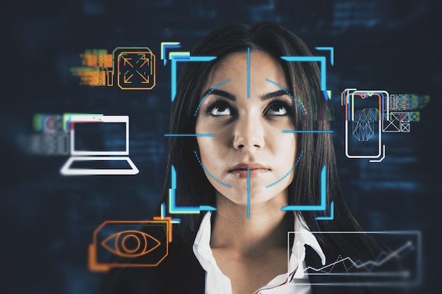 Portrait of attractive young european business woman with abstract glowing face recognition interface Technology and security concept Double exposure