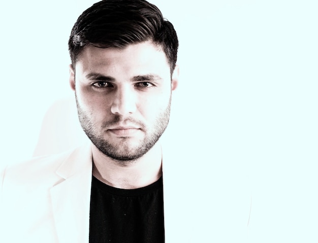portrait of young man against white background