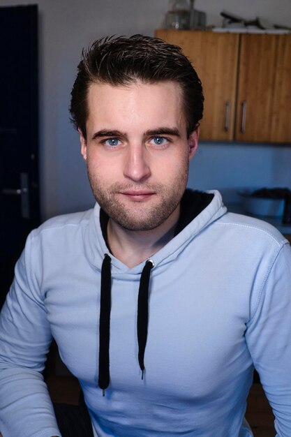 Portrait of young man at home