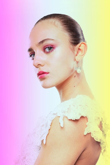 portrait of young woman against white background