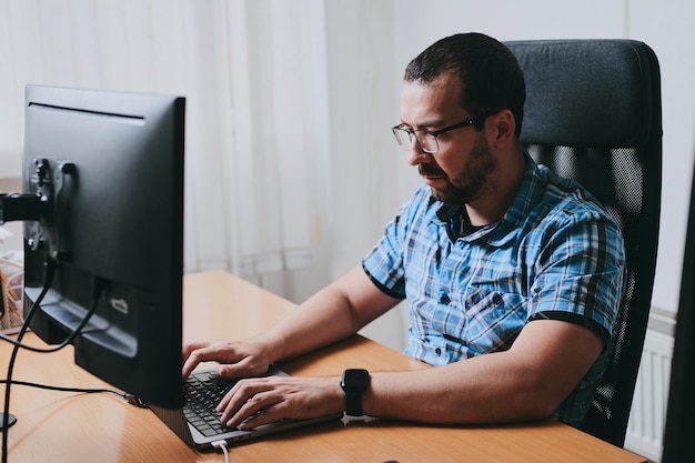 Portrait professional man programmer working concentrated on computer in diverse offices Modern IT technologies development artificial intelligence programs applications and video games concept