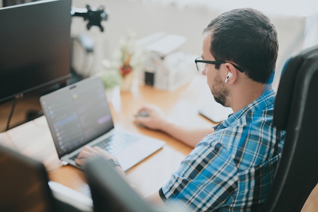 Portrait professional man programmer working concentrated on computer in diverse offices Modern IT technologies development of artificial intelligence programs applications and video games concept
