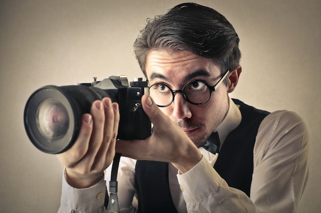 Professional photographer adjusting the camera