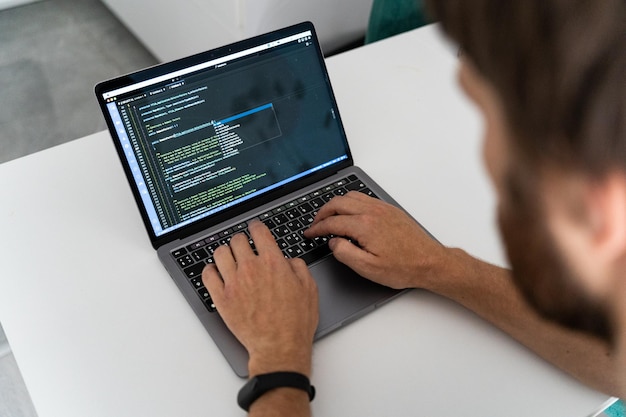 Programmer typing new lines of HTML