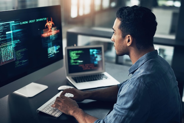 Programming error and man with cyber security typing and focus with digital software scam and finance Male person programmer or coder with technology internet connection or analytics with fraud