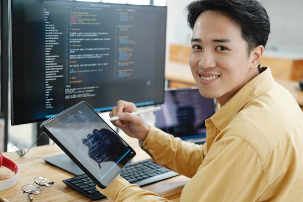 Programming Programmer Working On Computer In IT Office Sitting At Desk Writing Codes Programmer Typing Data Code Working On Project In Software Development Company