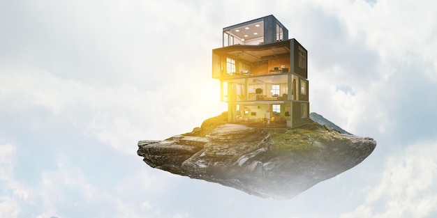 real estate concept with floating building. mixed media