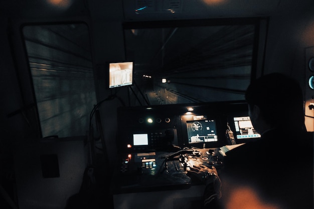 Rear view of man working at night