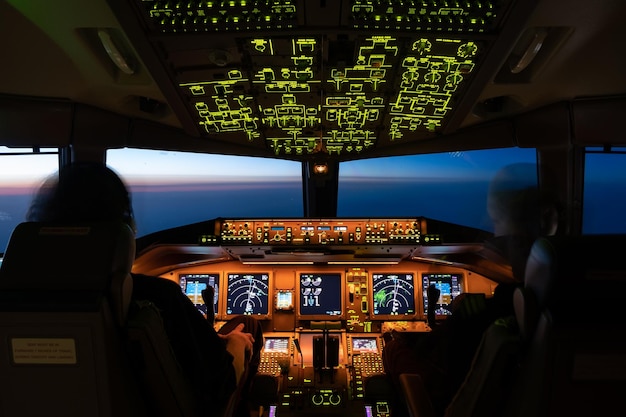 Rear view of pilots in cockpit