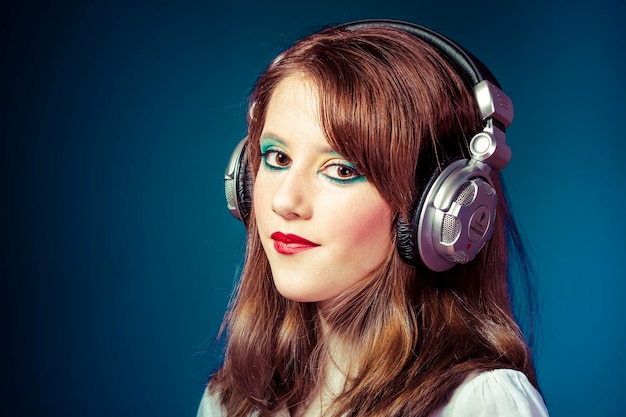 redhead teenager listening to rock music headphones