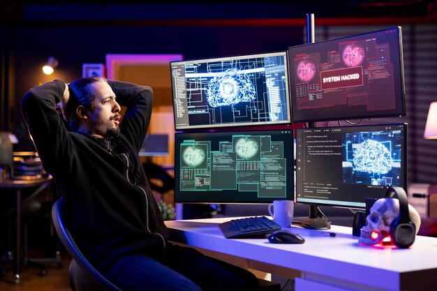 Rogue programmer at home coding on pc using ai to evade security with stealth malware hacker in