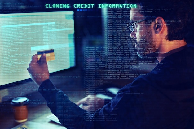 Scam credit card and overlay with man and computer for hacker cyber security and password theft Phishing technology and night with person and online crime for crypto malware and finance fraud
