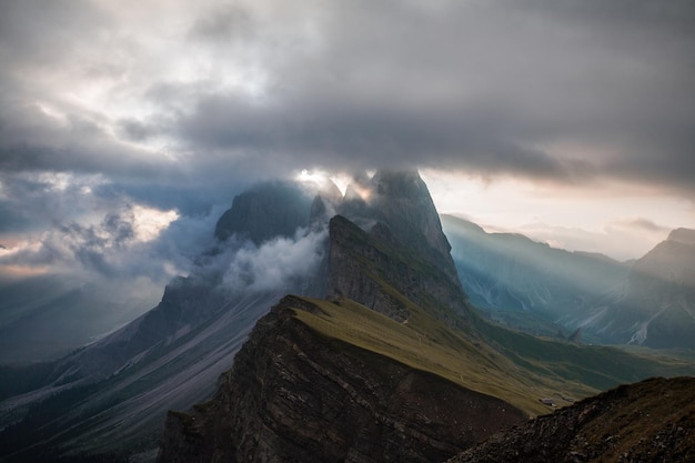 scenic view of mountains against cloudy sky