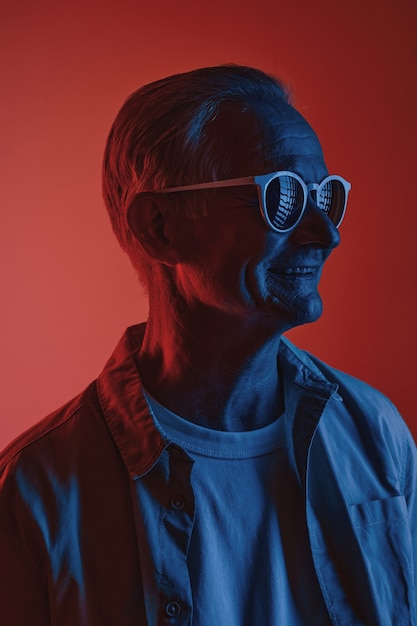 senior man in red and blue