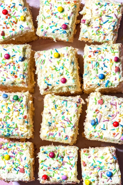 Slices of Colorful Sprinkles and Cream Sponge Cake