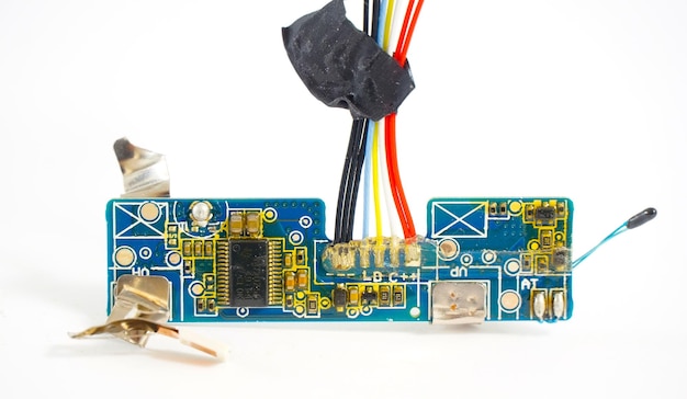 small damaged part of laptop electronic circuit board on white background