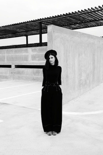 Smiling woman standing against wall