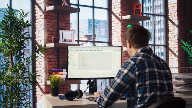 Software developer at computer coding creating software