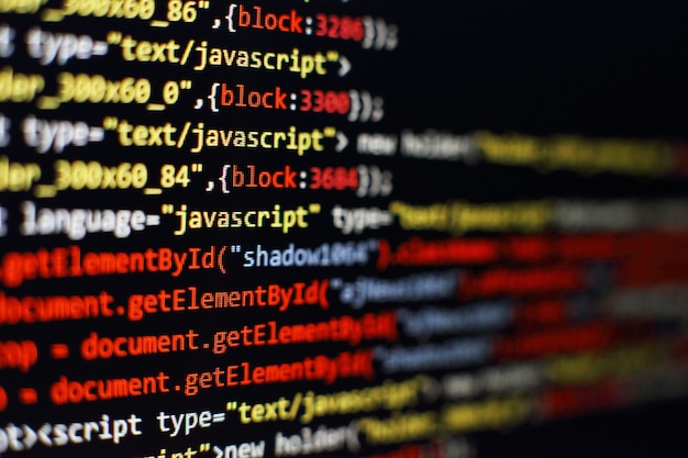 Software developer programming code. Abstract computer script code. Selective focus