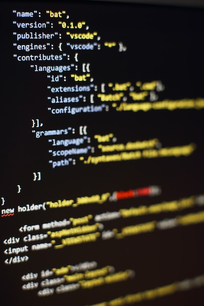 Software developer programming code. Abstract computer script code. Selective focus