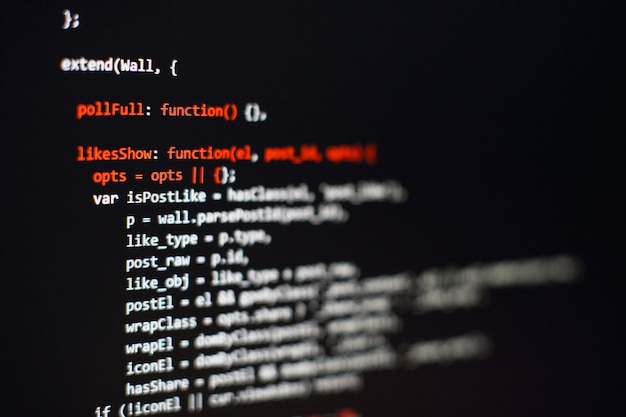 Software developer programming code. Abstract computer script code. Selective focus