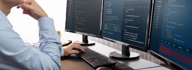 Software engineer working on application development on his computer display code and script on monitor at tech company office workplace Application developer solving and writing code Trailblazing
