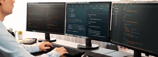Software engineer working on application development on his computer display code and script on monitor at tech company office workplace Application developer solving and writing code Trailblazing