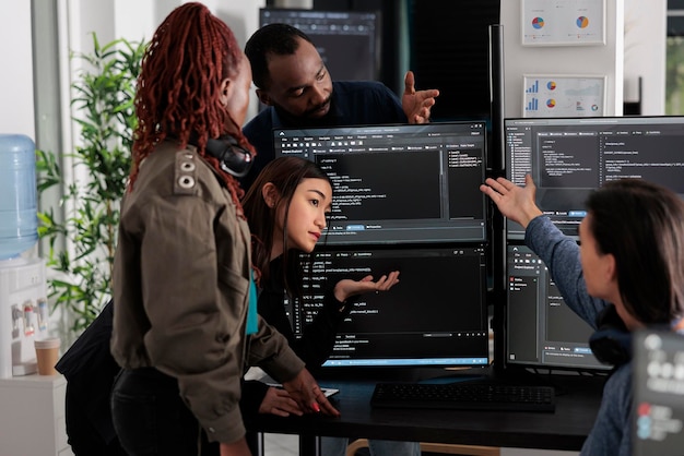 Software programmers analyzing html code and database, brainstorming script ideas to develop new security system. Engineers working with coding language collaborating on group project.