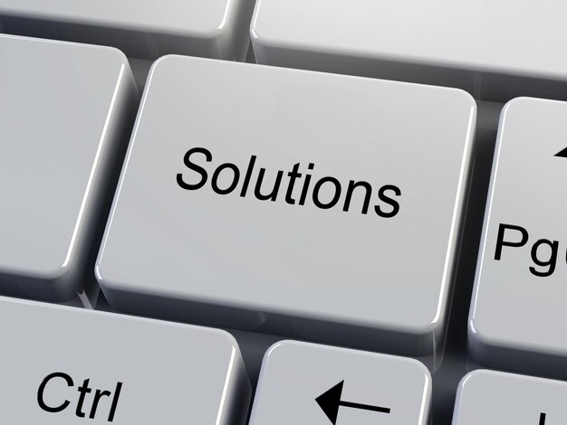 Solutions. A button on white keyboard. Business motivation