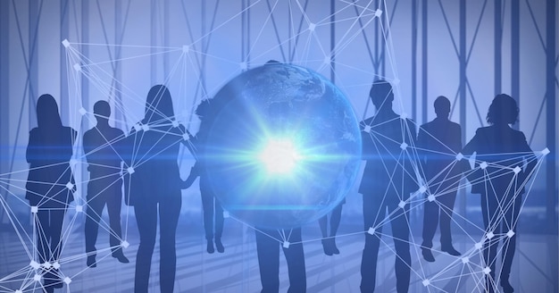 Spot of light over globe and network of connections against silhouettes of business people