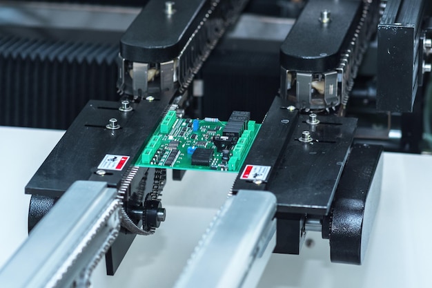 stage of printed circuit board production on the conveyor of automatic production line