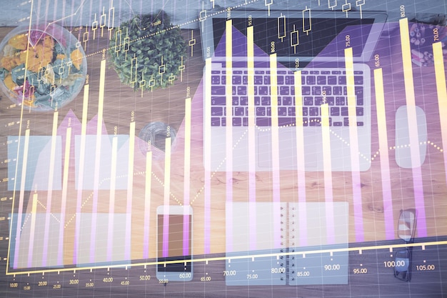 Stock market graph and top view computer on the table background Multi exposure Concept of financial education